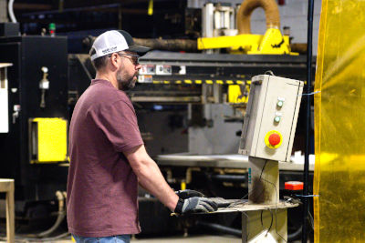 An engineer running a machine